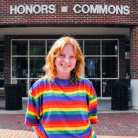 Picture of Meadow Jozwiak in front of the Honors Commons