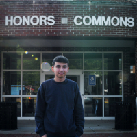 Picture of Miguel Montealegre in front of the Honors Commons