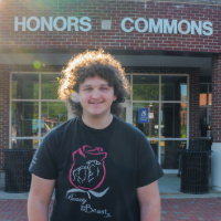 Picture of Noah Janceck in front of the Honors Commons