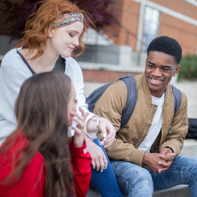 Students sitting outside Castle Heights