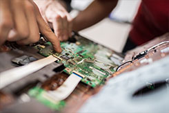 Students work on motherboard
