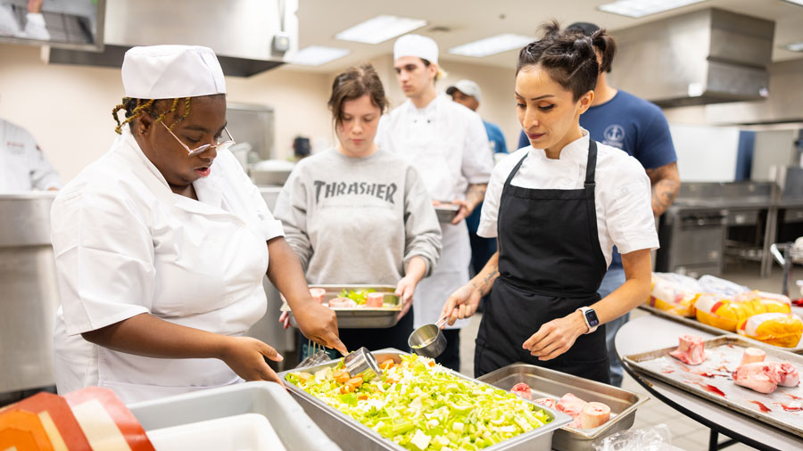 Students getting hands on experience in the kitchen