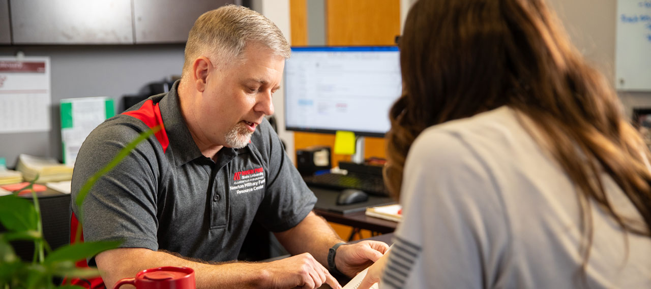Student going over options with advisor