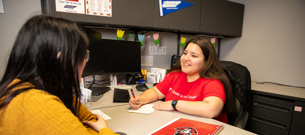 Student discussing their benefits with an advisor.