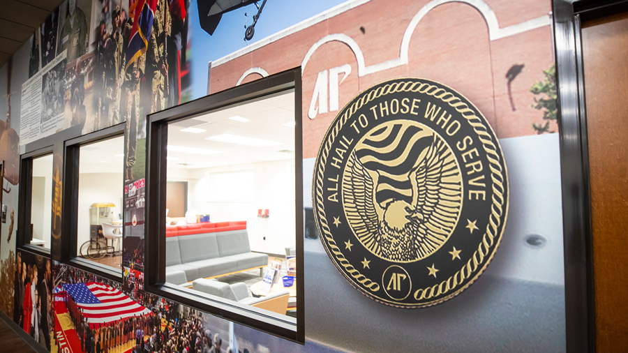 All hail to those who serve seal hanging on the wall.