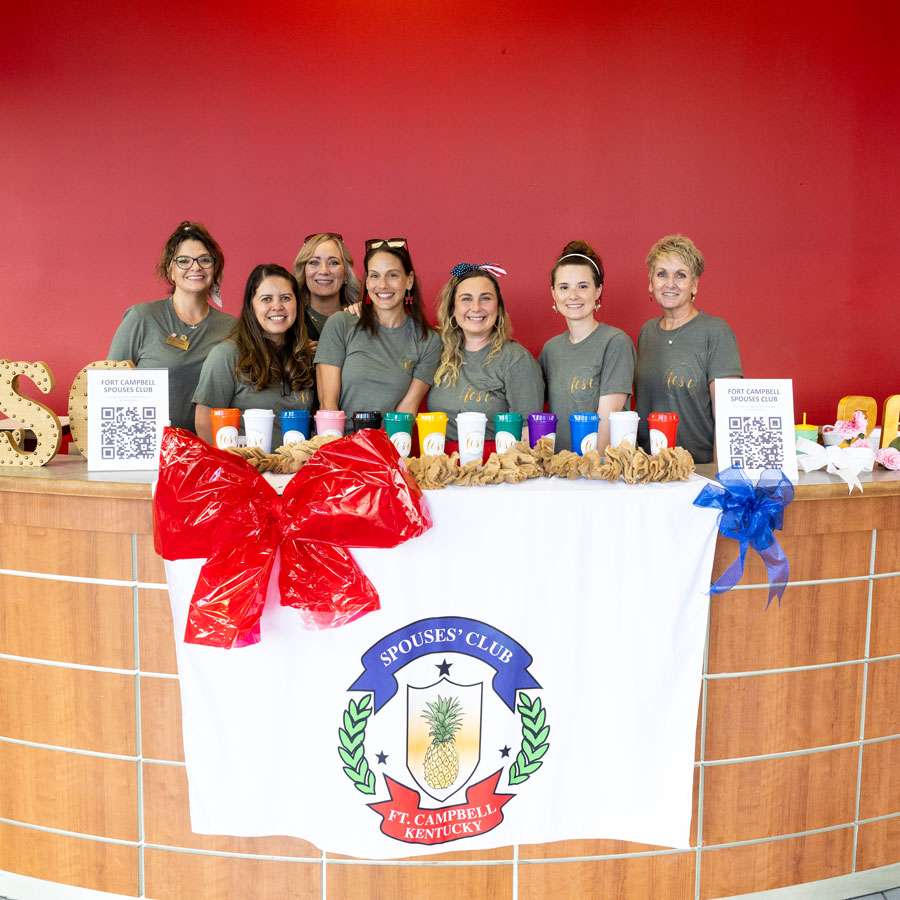 Members of the Spouse's Club posing for a group photo.