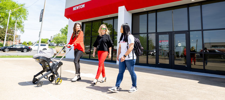 Military spouses talking outside the Newton Military Family Resource Center