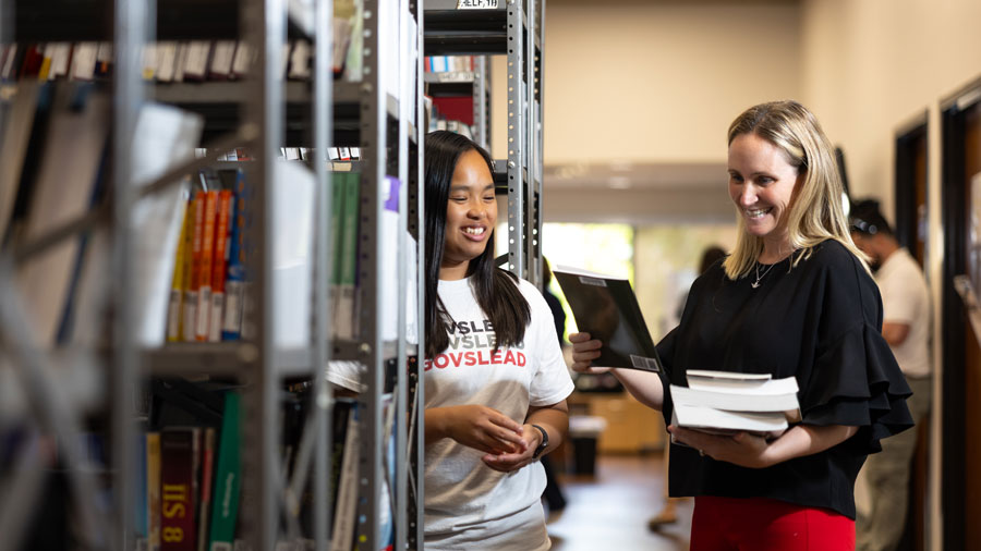 students looking at textbooks