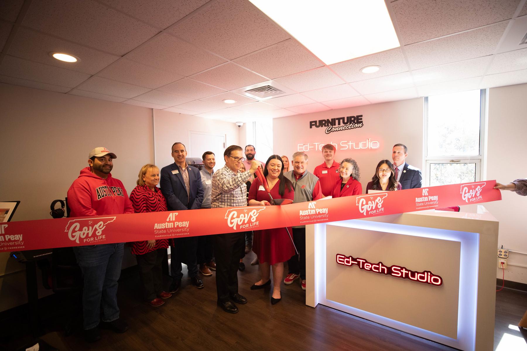 Furniture Connection’s David Berggren and Danielle Berggren cut the ribbon to open the new EdTech Studio at Austin Peay State University on March 11. University officials, students and Furniture Connection leaders attended the opening of the space, which will increase technological training for pre-service teachers. 