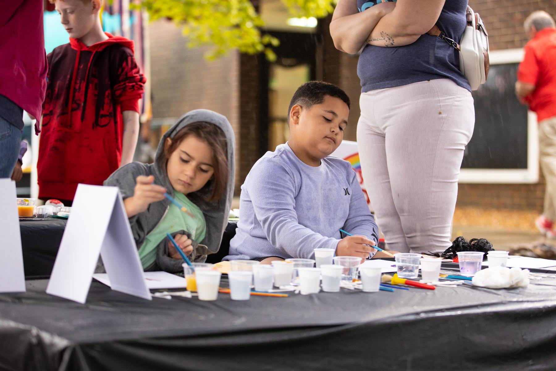 Art projects at the Little Govs CLC Day of Play help children hone their fine motor skills.