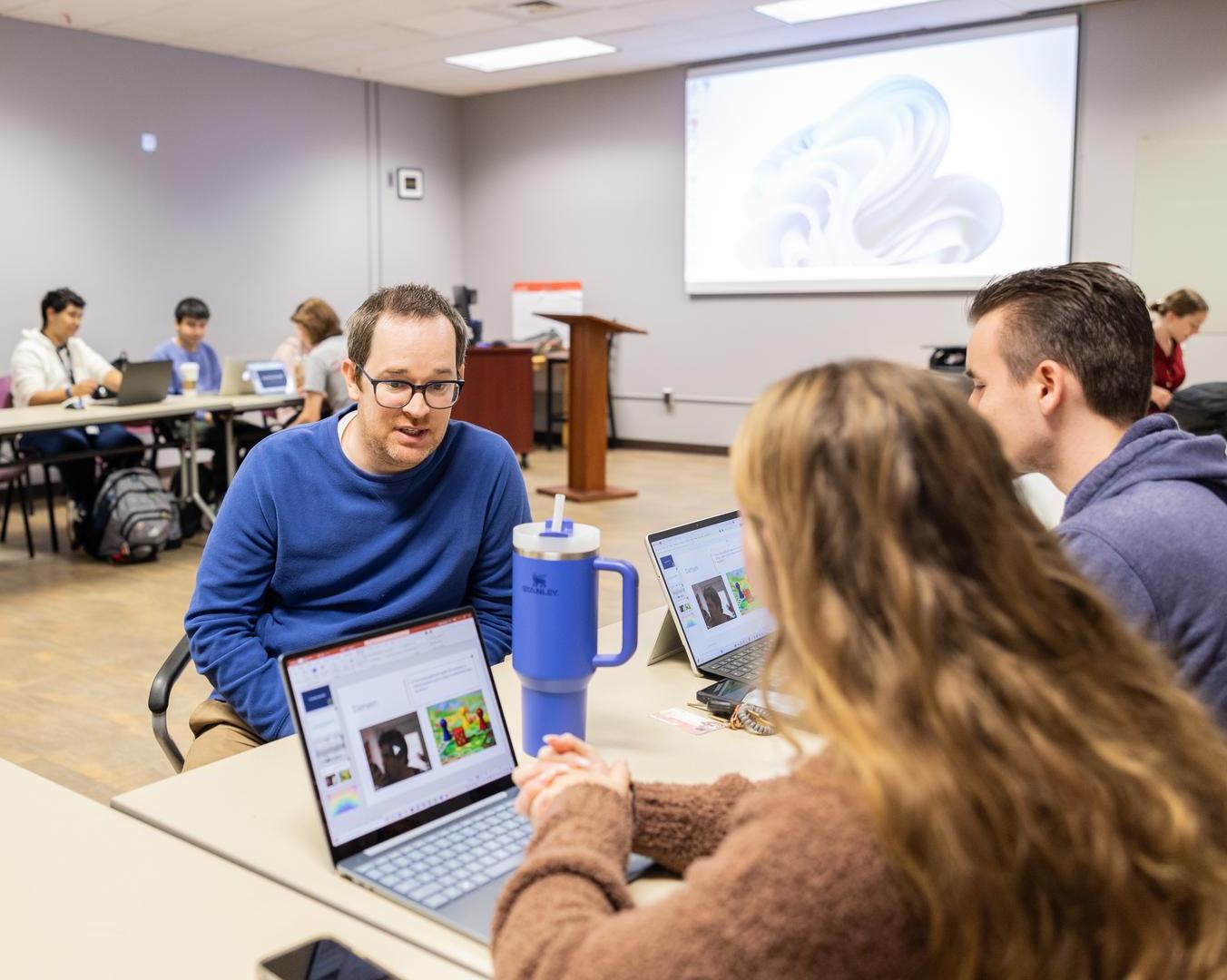 Austin Peay State University’s Dr. Zachary Barnes, an assistant professor in the Eriksson College of Education, interacts with students while teaching an honors course. 