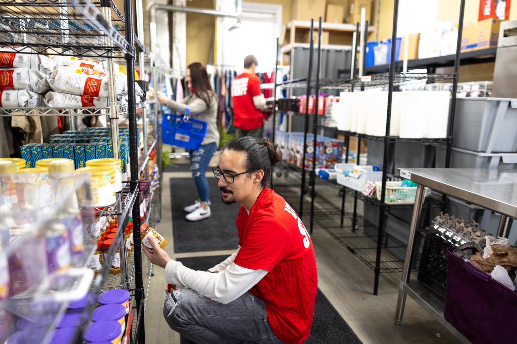 Volunteers work to stock the S.O.S. Food Pantry at Austin Peay State University with supplemental food items for students. | Photo by Madison Casey