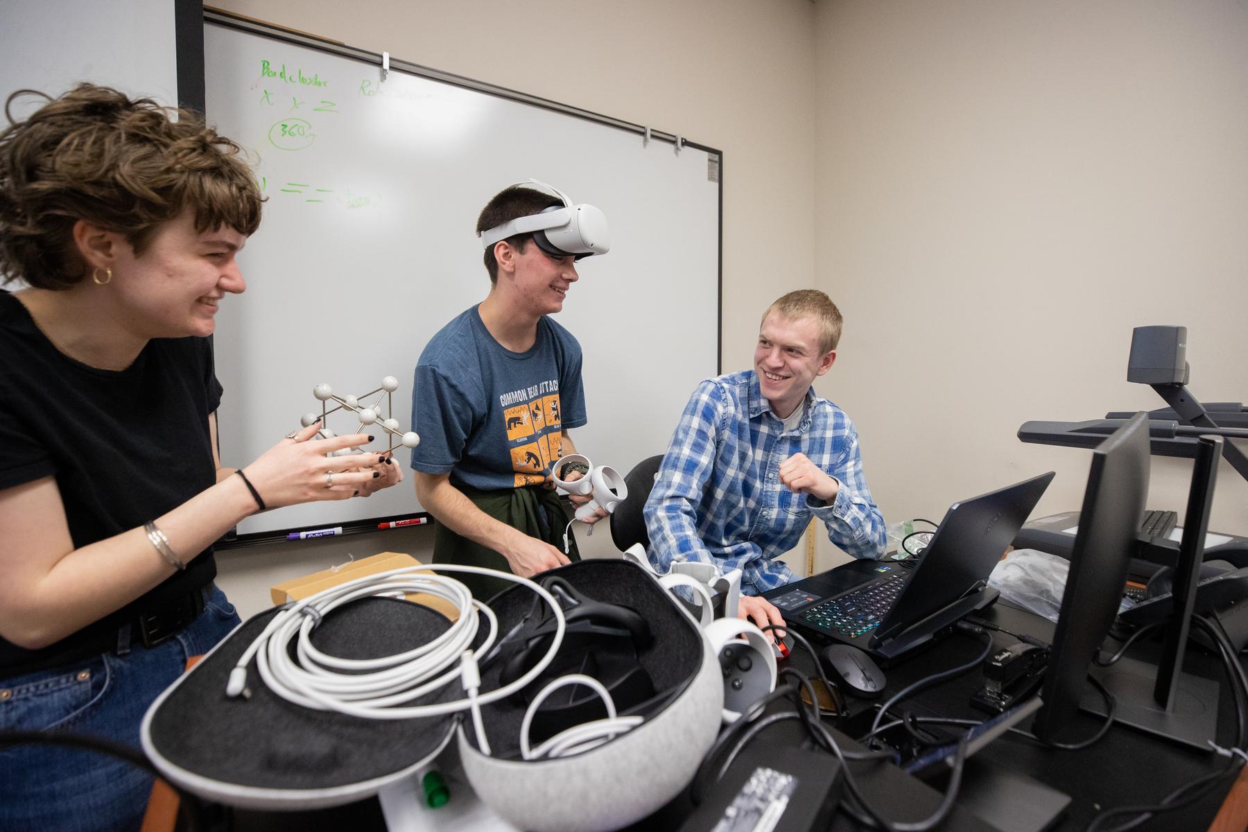 APSU students Calleway Schmidt, Owen Fink and Kaleb Scott collaborate on a VR-driven project to create a 3D library of chemical compounds. | Photo by Ally Shemwell