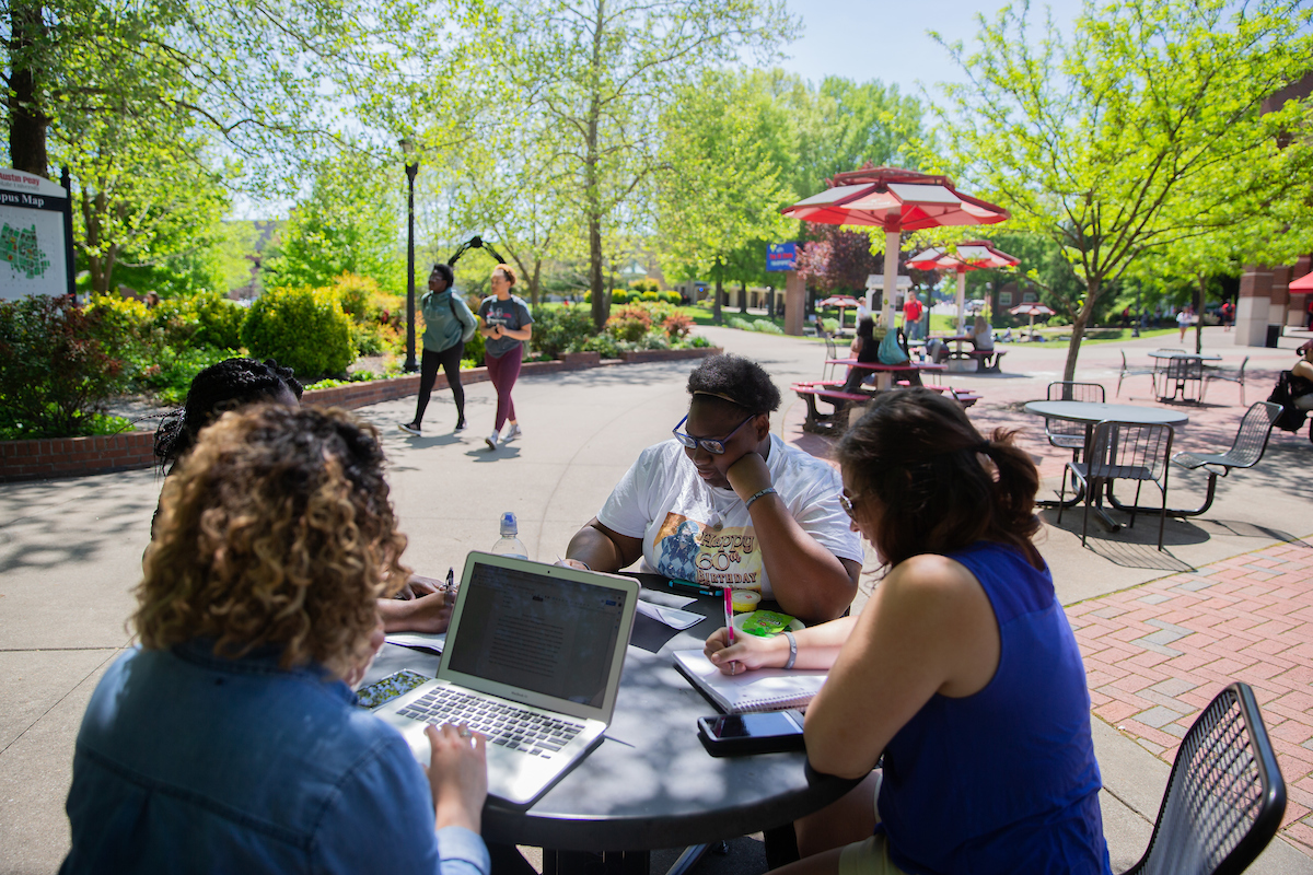 Each coach is physically located at the university, maintains a full-time presence on campus, and engages in the university environment alongside their students.