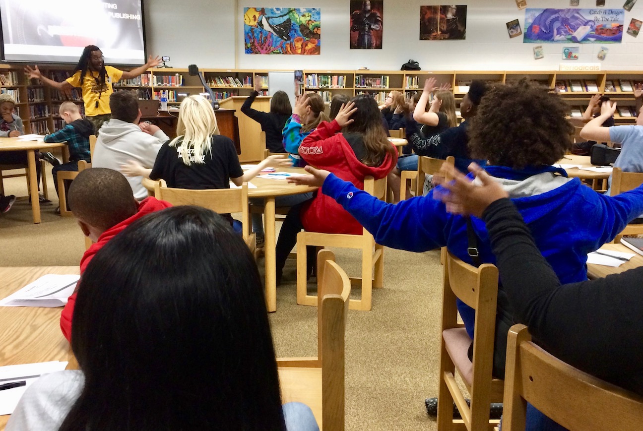 Armah gets Kenwood Middle School students to engage in the writing process.