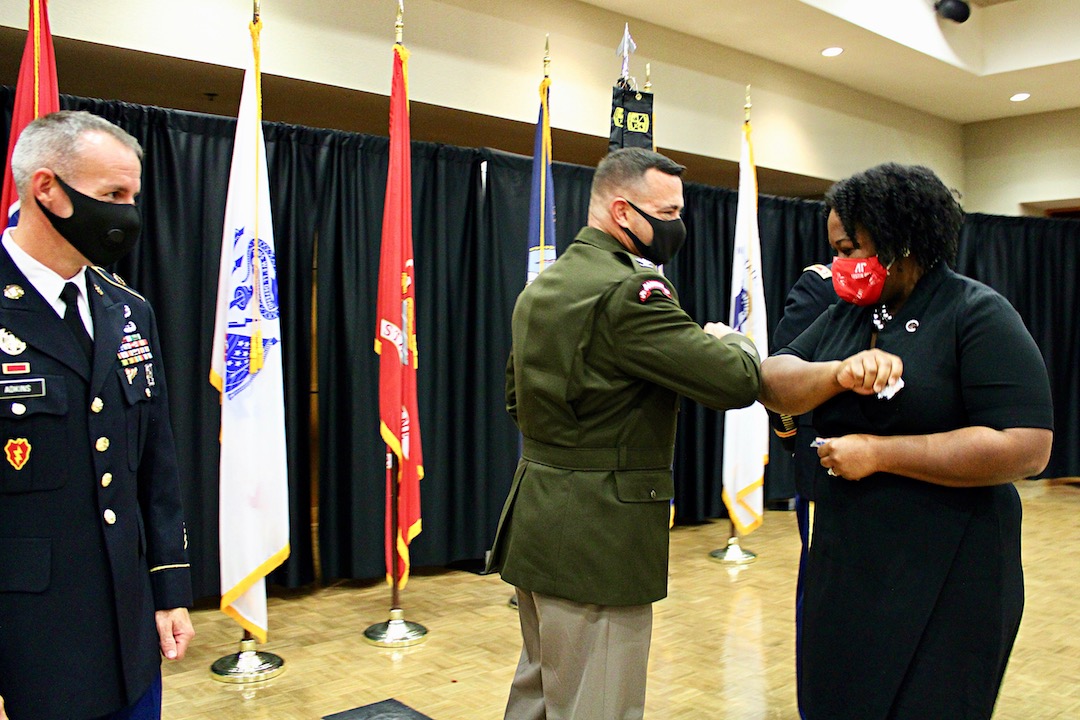 IMG 1802 - COL Brent Clemmer, U.S. Army, Commander – 7th ROTC Brigade, does an elbow bump with Dannelle Whiteside, APSU’s interim president, as CSM Shannon Adkins, U.S. Army, 7th ROTC Brigade, looks on.