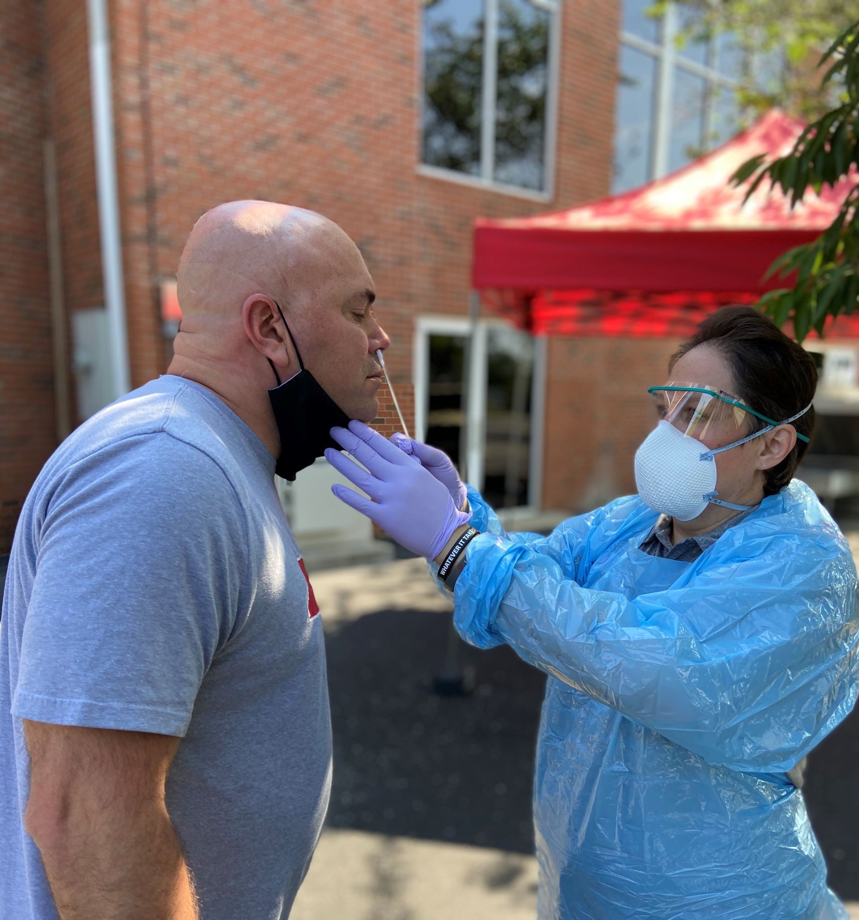 Austin Peay State University officials anticipate administering up to 25,000 COVID-19 vaccinations in the coming months to university students, employees and their families. Additionally, Austin Peay plans to open a new clinical laboratory Jan. 4 on campus that will help university healthcare workers deliver quicker, more accurate COVID-19 testing and results. The news comes as the COVID-19 pandemic has intensified across the country and in Tennessee, where the state is averaging more than 8,000 infections and 70 deaths per day. Vaccinating up to 25,000 people Austin Peay will be one of the vaccination pods in Montgomery County, said Dr. Heather Phillips, director of the university’s new clinical laboratory. “We would not only vaccinate the Austin Peay affiliates – the students, staff and faculty – but we would also be responsible for vaccinating their family members,” Phillips said on Thursday. Phillips’ lab has an “ultra-freeze” freezer, which is necessary to hold Pfizer’s vaccine. These freezers are “very hard to come by, they’re very pricey and most people don’t have them,” Phillips said. Joey Smith, Montgomery County’s public health director, “asked if the university would be willing to help not only store the vaccine for the Clarksville community, but if we would also be willing to vaccinate part of the community.” Phillips is hiring nursing staff and developing a schedule to support the effort, “vaccinating on the upward end as many as 25,000 individuals in the coming months.” Opening a lab for on-campus testing, results Phillips has set up a SARS-CoV-2 testing lab at Boyd Health Services on campus to perform PCR testing. SARS-CoV-2 (aka the novel coronavirus) is the virus that causes COVID-19. PCR (nasal swab) testing is the gold standard of novel coronavirus detection. “The PCR method is where we’re looking for a little, unique snippet of RNA,” Phillips said. “If (a patient) has that little snippet that tells me they have the virus. “This method is as close to 100% accurate as science will allow us to get, 99.999% accurate,” she added. Phillips and her team currently send test samples to Everlywell for results, which reduces test accuracy and slows results (currently about five days). The new lab will preserve accuracy and deliver results within 24 hours. She wanted to be clear: Even though the results will be fast, they will not be from rapid antigen testing, which can have an accuracy of only 48%. “An in-house lab allows us to process test samples without having to ship them, handle them with care and thereby reduce error, and ultimately share the results much more rapidly, even same day,” said Dr. Jeff Rutter, director of Boyd Health Services. “All these things matter a great deal in the midst of a pandemic.” The in-house lab also allows Phillips’ team to get nasal pharyngeal samples, reaching the cells that contain the ACE2 receptors where the novel coronavirus resides. Mitigating the risk of the virus spreading The quicker, more accurate testing at the new lab will have a direct and immediate positive impact on the community. “One person can expose roughly 22 people,” Phillips said. “We have the ability to prevent that from happening, and we’re going to do everything we can to keep those numbers down. “The more we can mitigate the risk of the virus spreading the better off not only Austin Peay’s campus will be, but the community outside of Austin Peay will be,” she added. The lab needs Clinical Laboratory Improvement Amendments certification to open, and Phillips expects that to happen by the planned Jan. 4 open date. “We’re going to hit the ground running,” Phillips said. “I already have between 500 and 600 people scheduled for that week.” Until then, Austin Peay will provide the current COVID-19 testing 7 a.m.-noon every weekday except on Christmas Eve, Christmas Day, New Year’s Eve and New Year’s Day. Austin Peay has administered more than 5,600 COVID-19 tests so far this fall. Recognizing a team effort Rutter wanted the community to know about the deep team involvement needed in making these efforts a reality at Austin Peay. “While I may have played a part in persuading (former APSU president) Dr. (Alisa) White to consider the necessity of providing COVID-19 testing on campus, I am certainly not the one responsible for envisioning and installing our in-house testing lab, which we have today,” Rutter said. “That project is the result of the excellent thought leadership and vision of my College of STEM colleagues, including Karen Meisch, Perry Scanlan, Chad Brooks, Heather Phillips and others who knew more about the benefits of processing test samples than I did,” he continued. “They deserve all the credit.” And Phillips lauded the frontline healthcare workers at Austin Peay – and throughout the community. Phillips’ testing team includes a graduate assistant and four nurses. The frontline workers at Austin Peay “are exposed to COVID-19 every single day,” she said. “We have all made sacrifices with our families, with our friends, with our children. I have not even kissed or loved or hugged my child in months because I’m concerned about giving them this virus that I work with every day. “Thank your healthcare workers. Thank your frontline workers,” she added. “They are sacrificing an abundance of family time and personal time.” To learn more • For more information about COVID-19 testing at Austin Peay, visit www.apsu.edu/covidtesting. • For more information about Boyd Health Services, go to https://apsu.edu/health-and-counseling/boyd-health-services.