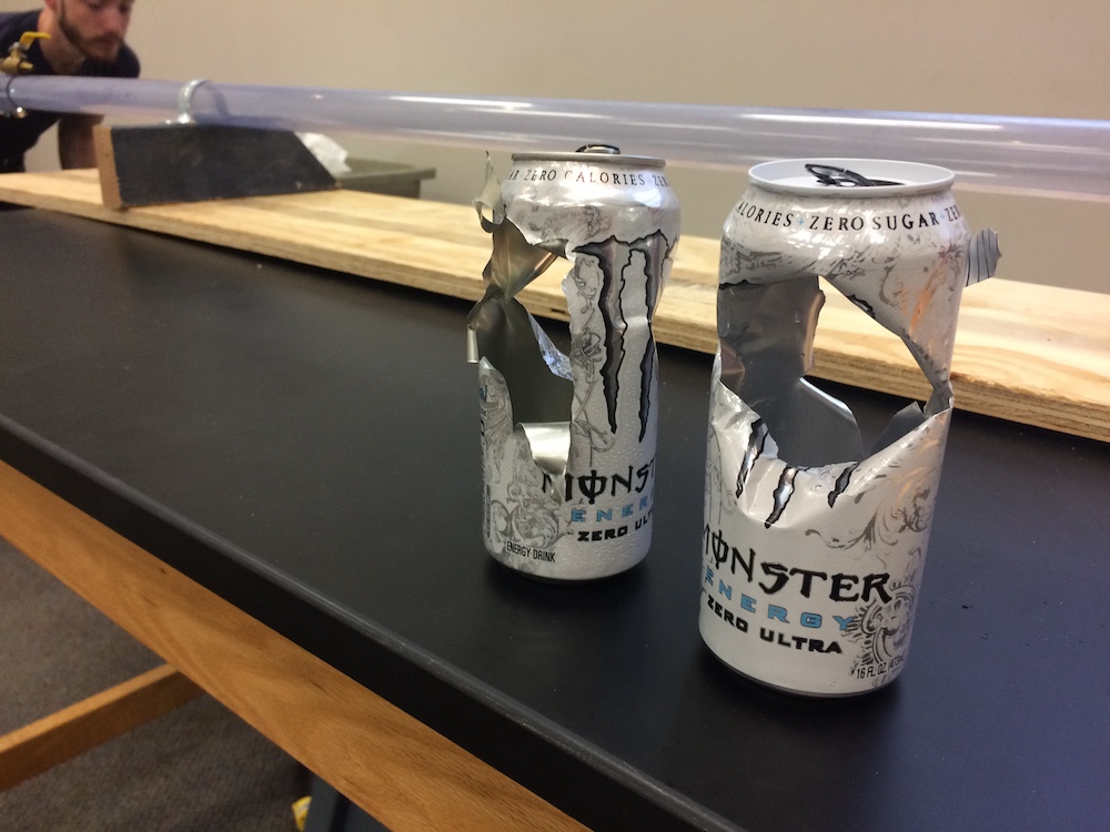 The cannon propelled pingpong balls at more than 450 mph through these two cans.