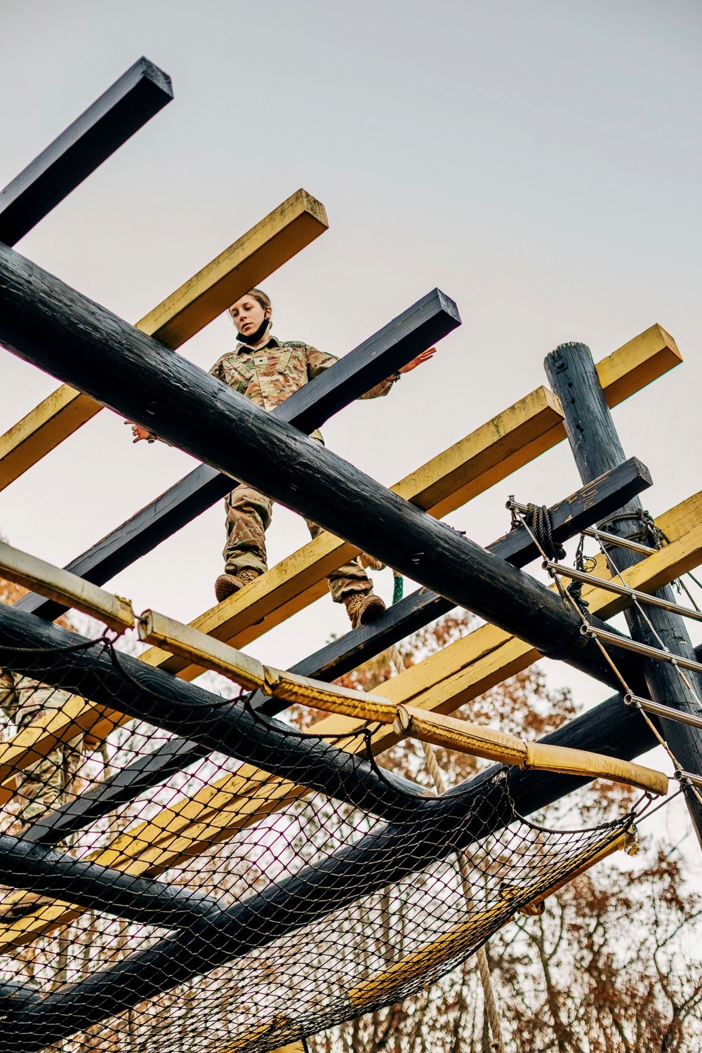 Junior cadet Cherady Fine negotiates the “tough one” at the Air Assault School obstacle course.