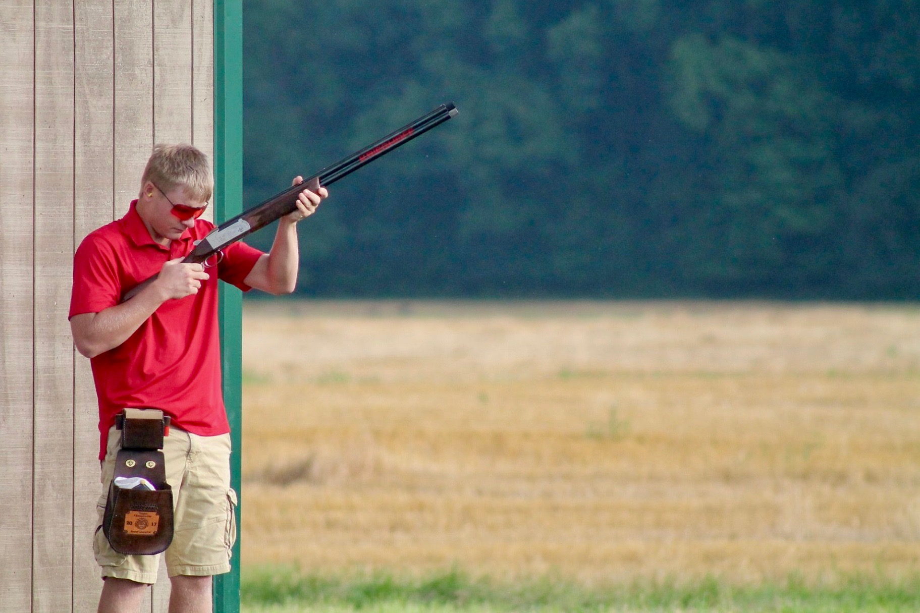 Austin Peay's John Michael Baggett prepares his gun for one of the events at the Scholastic Clay Target Program national championships in Marengo, Ohio. 