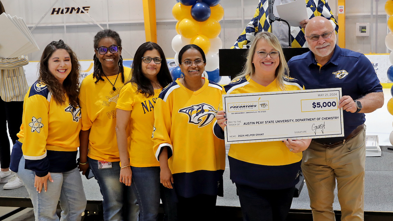 Austin Peay State University faculty and staff members receive $5,000 from the Nashville Predators Foundation during the organization’s annual Helper Grant Check Presentation Ceremony. 

