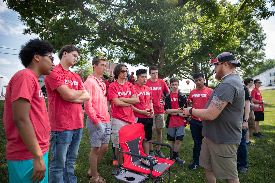 Michael Hunter of the Drone Club at Austin Peay shows off one of his racing drones to the Governor's School for Computational Physics students.