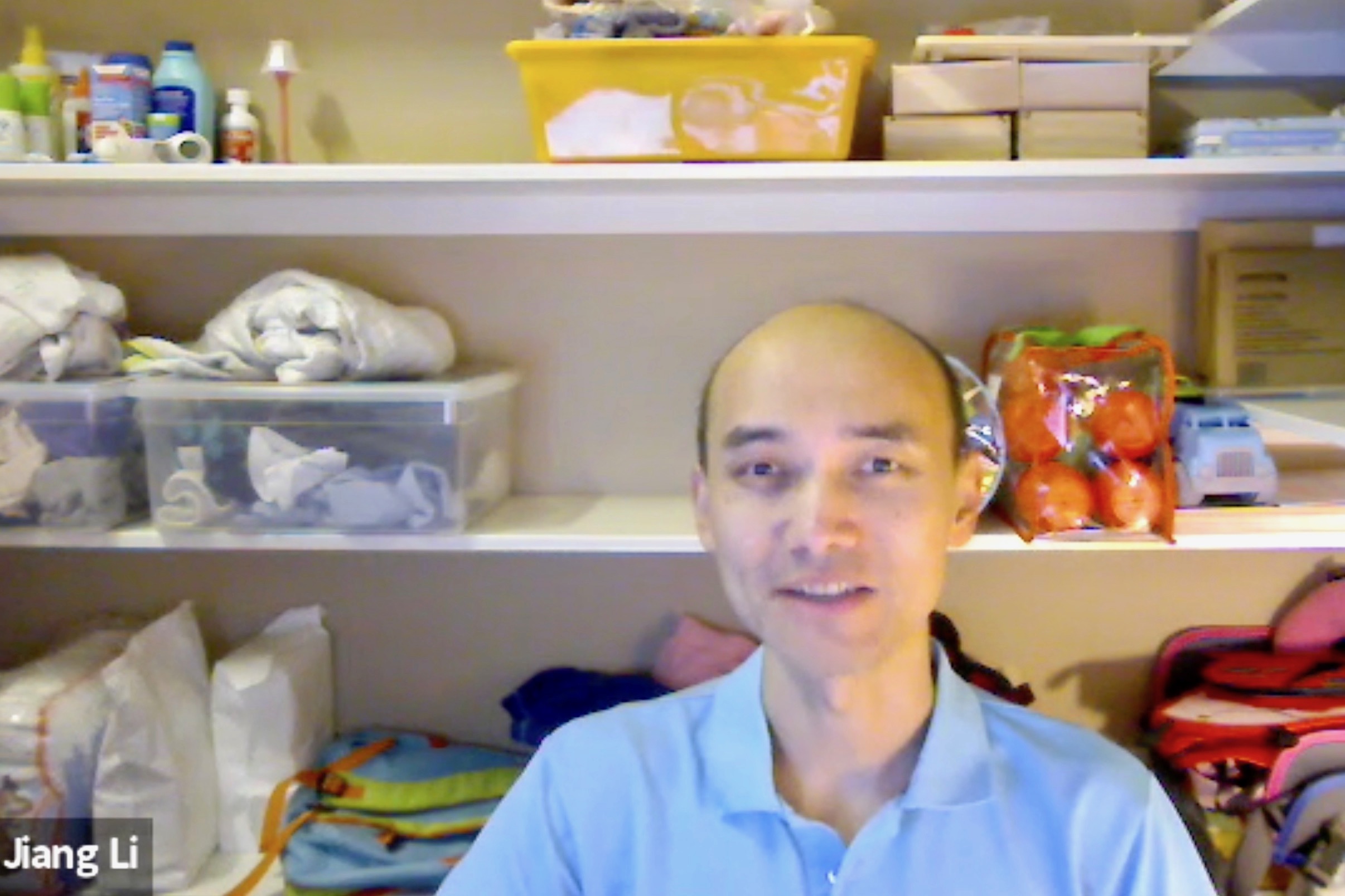 Dr. Jiang Li talks on Zoom from one of the closets at his house.