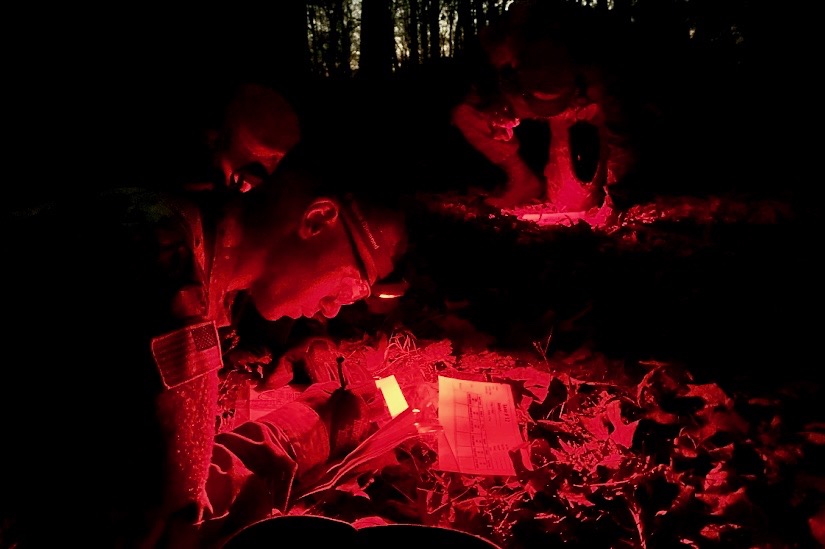 Cadets plot their night land navigation points before moving on to the course.