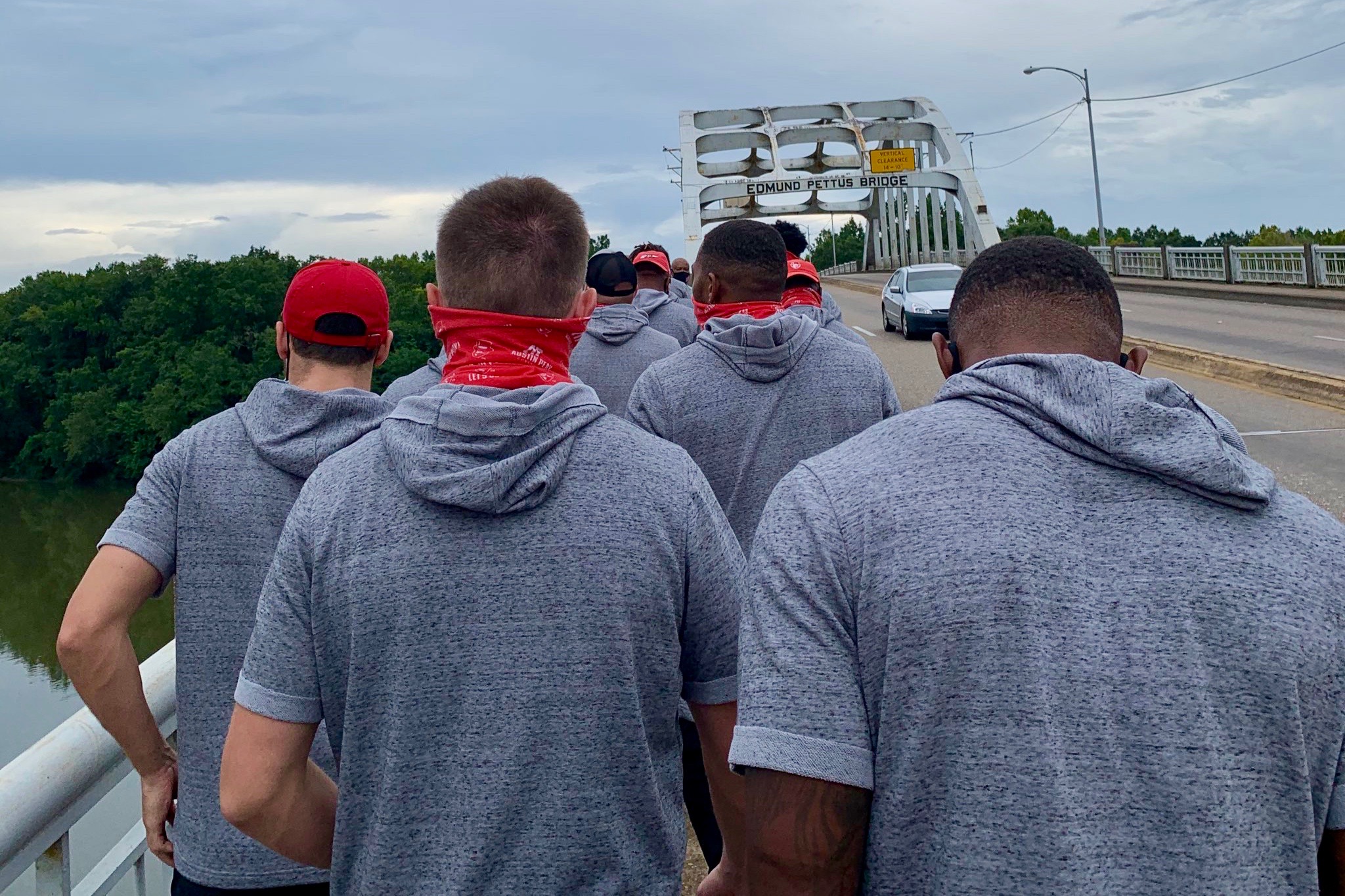 Members of Austin Peay’s football team on Friday, Aug. 28, made a special stop in Selma, Alabama, to walk across the Edmund Pettus Bridge.  “What a great experience in Selma with our Govs football student athletes!” Austin Peay’s Director of Athletics Gerald Harrison wrote on Twitter. “Also great to have President Dannell Whiteside join us as we walked across the Edmund Pettus Bridge.  “Today we all learned a little more about Good Trouble,” Harrison wrote.  Whiteside, APSU’s interim president, noted in a tweet, “Powerful moment with @GovsFB walking across the Edmund Pettus Bridge!”  USA Today’s Phil Kaplan noted the visit followed in the footsteps of civil rights icon John Lewis, who died July 17. Lewis led a march across the bridge on March 7, 1965, to raise awareness of racial inequities in voting registration. State troopers attacked Lewis and fractured his skull after he crossed the bridge. A photograph of Lewis succumbing to the trooper’s blows is an iconic image of the civil rights movement.  In a June 2018 tweet, Lewis reflected on the continuing fight against racial inequities: “Do not get lost in a sea of despair. Be hopeful, be optimistic. Our struggle is not the struggle of a day, a week, a month, or a year, it is the struggle of a lifetime. Never, ever be afraid to make some noise and get in good trouble, necessary trouble.”  The football team’s visit to the bridge came a day before their game against Central Arkansas in the 2020 Guardian Credit Union FCS Kickoff in Montgomery, Alabama. The game was the first college football game of the season and received a national audience during primetime on ESPN. After opening the game with a 75-yard touchdown, the Govs lost on a last-minute touchdown, 24-17.