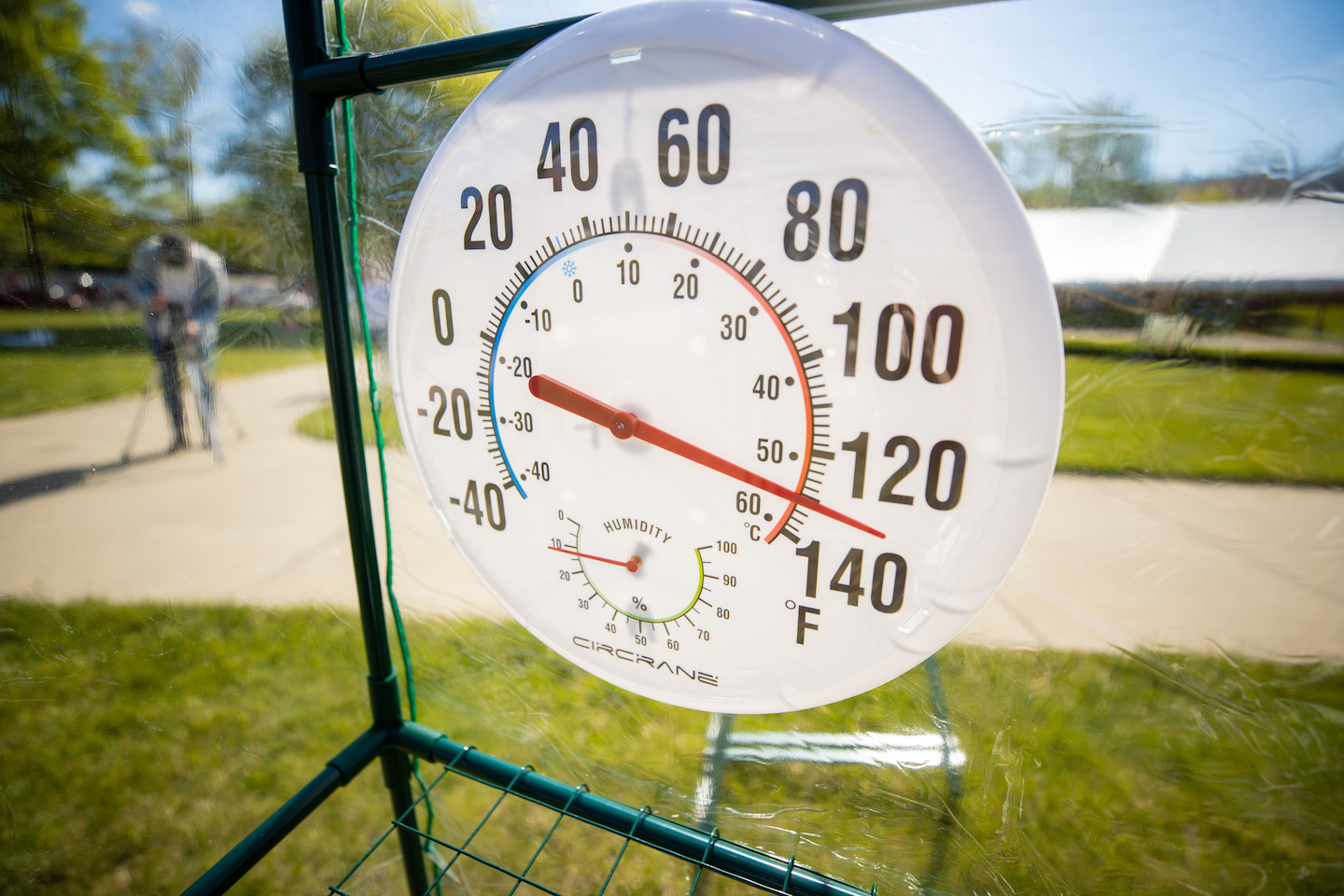 On Earth Day, the Art + Design lawn at Austin Peay State University had an interesting sight to see. Eliza Evans, an environmental artist of about 10 years, was taking part in a durational performance piece where she spent several hours in a “time machine.” This time machine, a commercial greenhouse, helped to show what the future may look like on Earth. Instead of using statistics and graphs to indicate the changes in the environment, Evans used her body as a proxy. During this performance, Evans stayed in the time machine for seven hours. Through this, the experiment showed how the human body copes with the effects of the environment, much like the Earth. “This is just an experiment for me to try to anticipate what the world might be like towards the end of my life,” Evans said. Evans referred to this art piece as a “personal exploration.” She also shared the experience with those brave enough to step into the time machine. I had the opportunity of experiencing what Eliza was while also getting to know her better. I stayed in the time machine for a little over 13 minutes, but only a few minutes in, I felt extremely uncomfortable. Evans discussed how our shared traits allow us to adapt and create solutions together to combat issues we face. “We have a problem, and we don’t know how bad it is going to be. We need to help each other,” Evans said. This is not Evans’ first time undergoing this durational performance piece. When Evans was on an artist’s residency in New York, she put out a greenhouse on a lawn as an experiment to see what would happen. Evans said the people who brought her fruit and ice on their own showed her how beautiful this experiment is. “They just pitched in,” Evans said. “That wasn’t even a question I posed.” The experiment Evans participated in on APSU’s campus had more structure. In the first experiment Evans conducted, she kept track of her heart rate thinking she could take care of her own health. This performance was also a collaboration with the APSU School of Nursing. Nursing students took Evans’ vitals throughout her performance to see how the heat was affecting her. “This project has already created a context for the community nursing projects on water quality and community health,” Evans said. “These two projects are in conversation with each other which I think is phenomenal.” Evans’ goal is to make people aware of the effects Earth is undergoing. “Even if they disagree, even if someone isn’t quite convinced that climate change is real or that it’s caused by humans, people have positions all along the spectrum, and I’m willing to engage with any,” Evans said. Evans said she finds conversations with others about her art is a rewarding part of the process. Evans saw the Earth Day performance as a perfect opportunity to help bring awareness to climate change and its effects on the Earth. “Every day is Earth Day to me,” Evans said. Visit Evans’ website to learn more about her work. The performance was sponsored by the Department of Art + Design with support from The Center of Excellence for the Creative Arts.