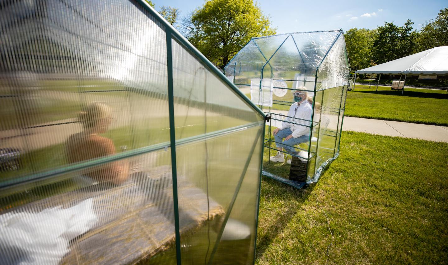 On Earth Day, the Art + Design lawn at Austin Peay State University had an interesting sight to see. Eliza Evans, an environmental artist of about 10 years, was taking part in a durational performance piece where she spent several hours in a “time machine.” This time machine, a commercial greenhouse, helped to show what the future may look like on Earth. Instead of using statistics and graphs to indicate the changes in the environment, Evans used her body as a proxy. During this performance, Evans stayed in the time machine for seven hours. Through this, the experiment showed how the human body copes with the effects of the environment, much like the Earth. “This is just an experiment for me to try to anticipate what the world might be like towards the end of my life,” Evans said. Evans referred to this art piece as a “personal exploration.” She also shared the experience with those brave enough to step into the time machine. I had the opportunity of experiencing what Eliza was while also getting to know her better. I stayed in the time machine for a little over 13 minutes, but only a few minutes in, I felt extremely uncomfortable. Evans discussed how our shared traits allow us to adapt and create solutions together to combat issues we face. “We have a problem, and we don’t know how bad it is going to be. We need to help each other,” Evans said. This is not Evans’ first time undergoing this durational performance piece. When Evans was on an artist’s residency in New York, she put out a greenhouse on a lawn as an experiment to see what would happen. Evans said the people who brought her fruit and ice on their own showed her how beautiful this experiment is. “They just pitched in,” Evans said. “That wasn’t even a question I posed.” The experiment Evans participated in on APSU’s campus had more structure. In the first experiment Evans conducted, she kept track of her heart rate thinking she could take care of her own health. This performance was also a collaboration with the APSU School of Nursing. Nursing students took Evans’ vitals throughout her performance to see how the heat was affecting her. “This project has already created a context for the community nursing projects on water quality and community health,” Evans said. “These two projects are in conversation with each other which I think is phenomenal.” Evans’ goal is to make people aware of the effects Earth is undergoing. “Even if they disagree, even if someone isn’t quite convinced that climate change is real or that it’s caused by humans, people have positions all along the spectrum, and I’m willing to engage with any,” Evans said. Evans said she finds conversations with others about her art is a rewarding part of the process. Evans saw the Earth Day performance as a perfect opportunity to help bring awareness to climate change and its effects on the Earth. “Every day is Earth Day to me,” Evans said. Visit Evans’ website to learn more about her work. The performance was sponsored by the Department of Art + Design with support from The Center of Excellence for the Creative Arts.