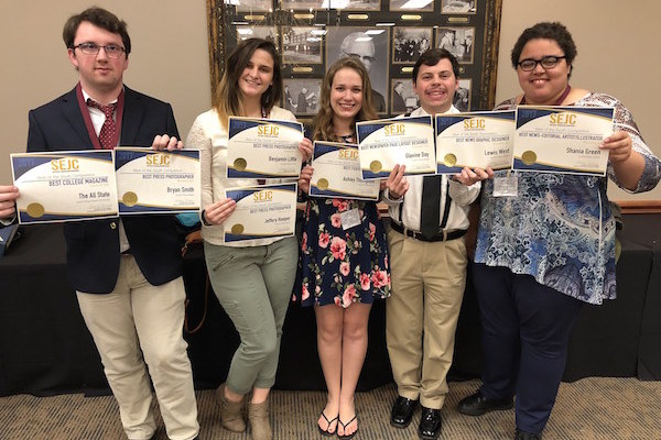 Student winners from The All State hold up their awards.
