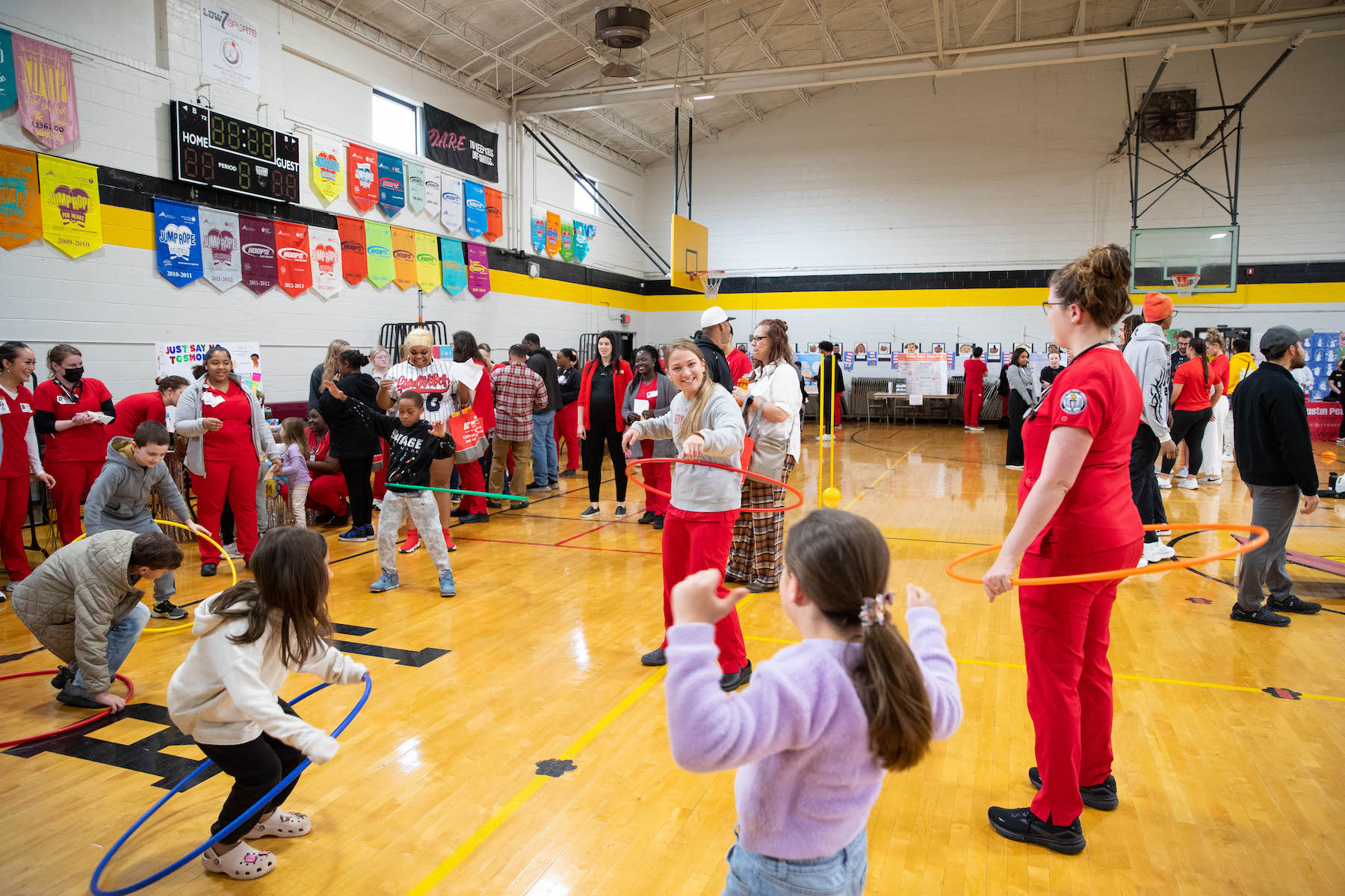 Students from APSU’s School of Nursing lead a children’s hula hoop competition at Burt Elementary School during the 2024 Wellness Hub. 