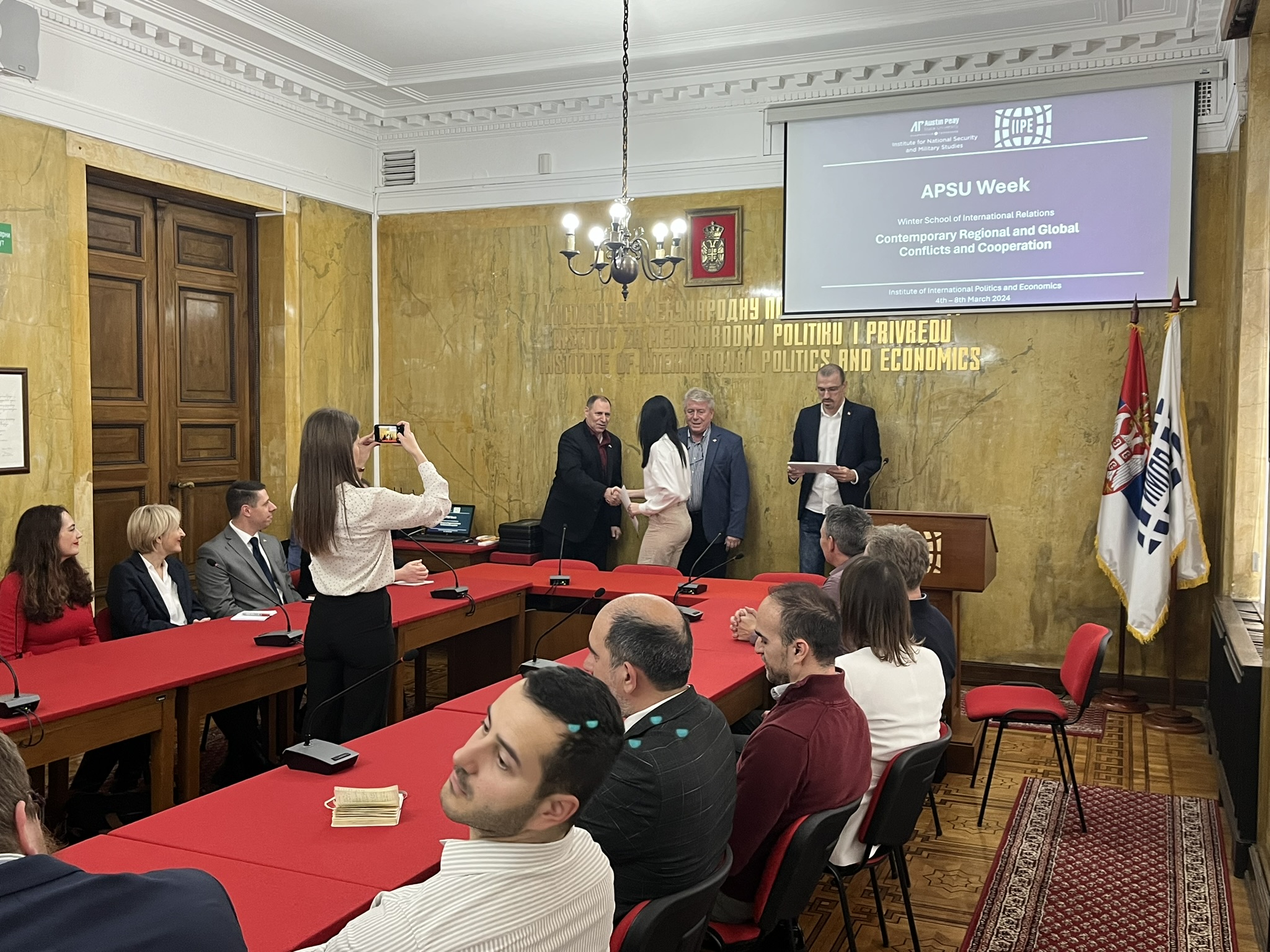 INSMS Director Dr. Rich Mifsud congratulates a student on the successful completion of APSU Week. Mifsud is flanked by IIPE Director Dr. Branislav Đorđević and IIPE Senior Researcher Dr. Vladimir Trapara as members of the U.S. Embassy delegation look on to the left.