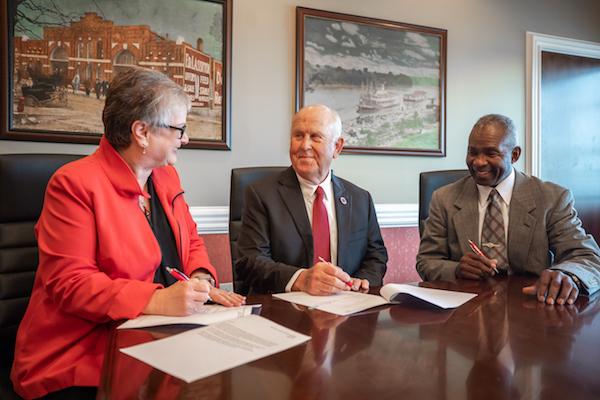 APSU President Alisa White signs paperwork establishing the new endowed scholarship