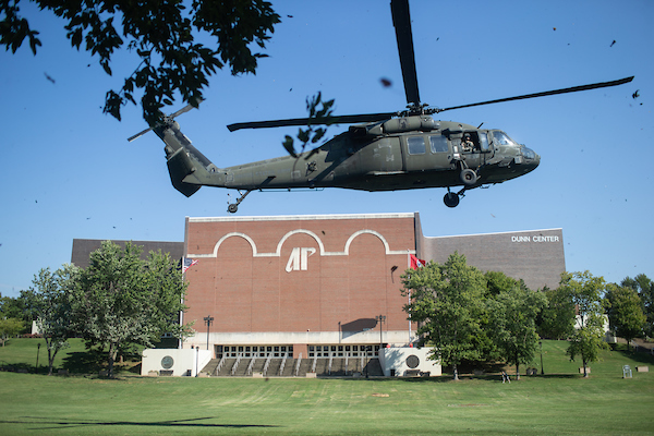 A Blackhawk helicopter lands on campus.