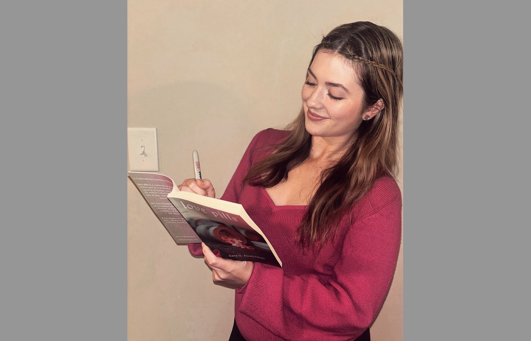 Sara Klosterman with a copy of her poetry collection 