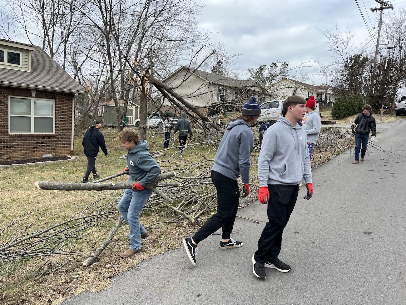 The Austin Peay baseball team helps clean debris after a tornado.