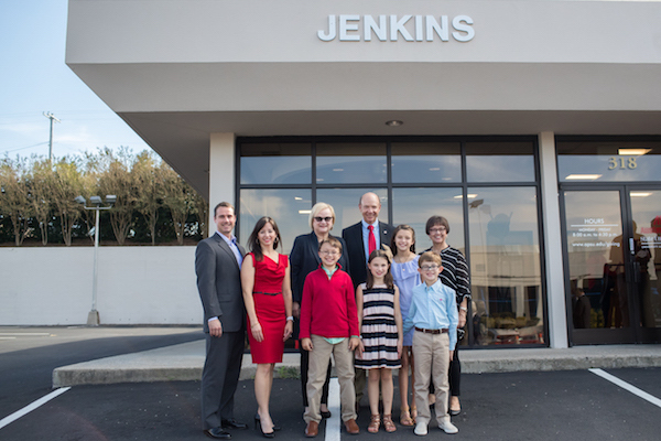 The Jenkins family stands with APSU President Alisa White in front of APSU's Jenkins Building.
