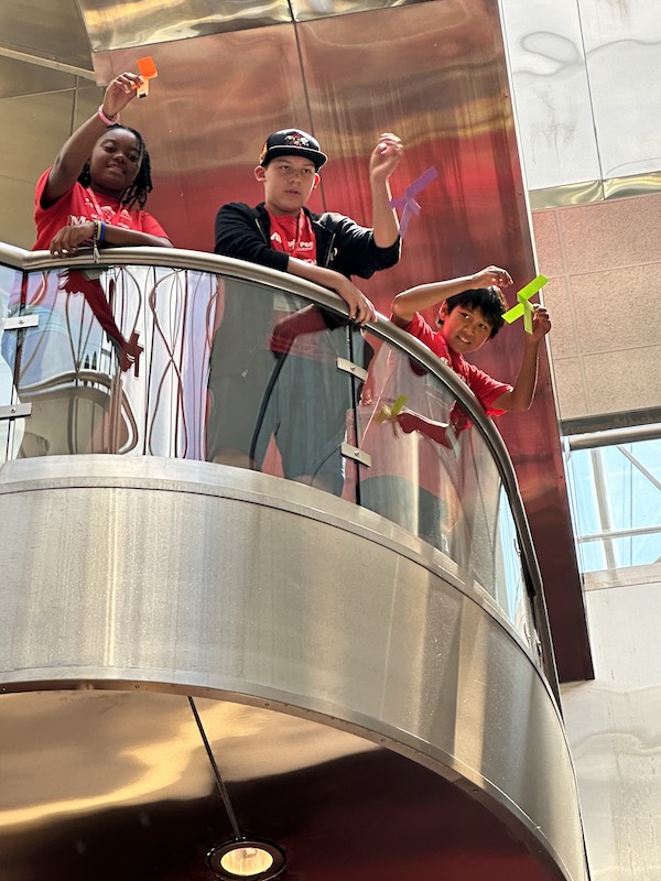 Students drop makeshift parachutes at the SOARing with Mathematics camp.