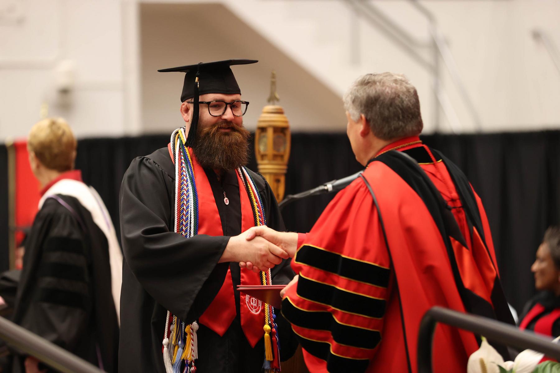 Retired Army CW4 Brandon Morris receives his bachelor's degree during APSU's Spring 2023 commencement ceremony. 