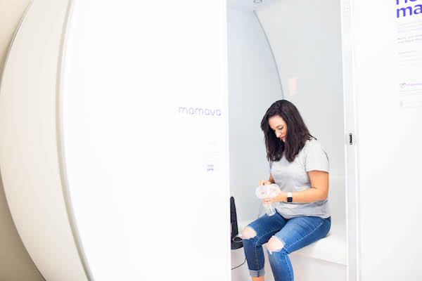 A student sits in a new lactation pod on campus.