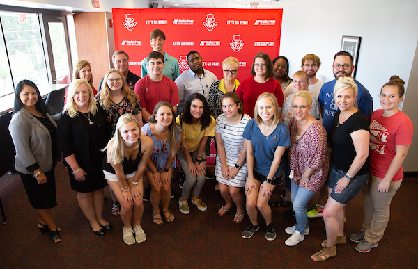 Members of the Legacy Lunch take a photo with APSU President Alisa White.