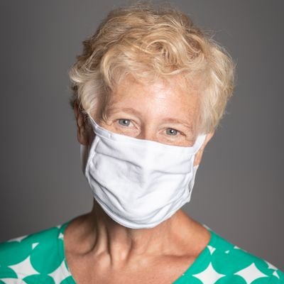 Lynn Fisher headshot, wearing a facemask.