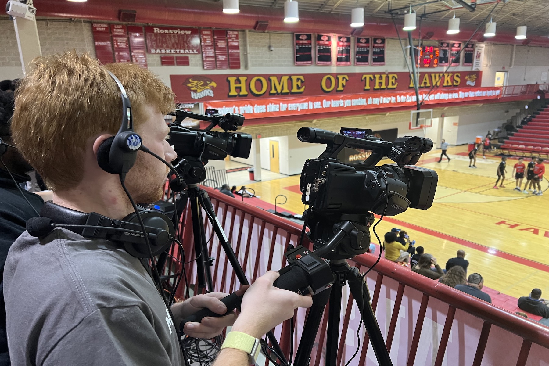 Students from professor Barry Gresham's Sports Announcing class broadcast a basketball game from Rossview High School. 