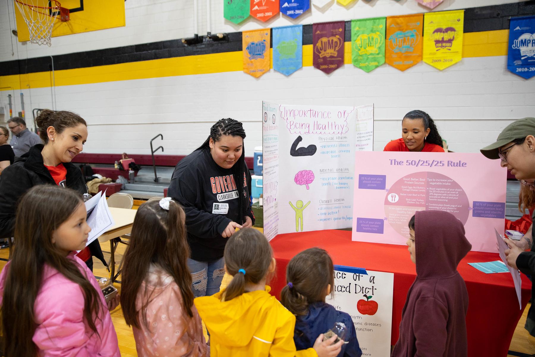 Students and faculty from Austin Peay State University's Master of Public Health (MPH) program speak with children at Burt Elementary School on the importance of being healthy.