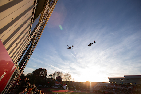Military helicopters fly over Fortera Stadium