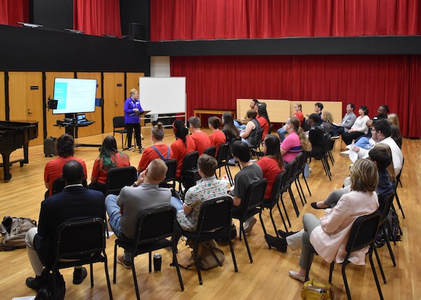 Dr. Julie Scott presents to a classroom of students, faculty and music advisors.