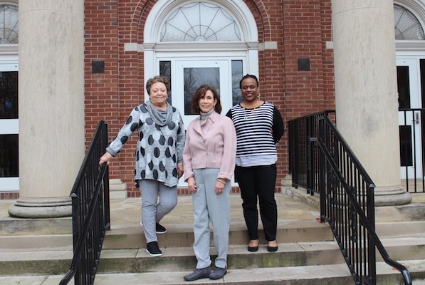Three members of APSU's nursing faculty stand in front of the McCord Building. 