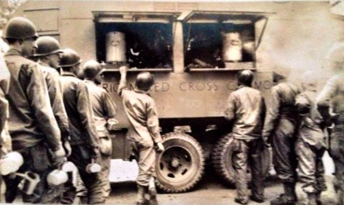 Soldiers line up for food at a Red Cross Truck